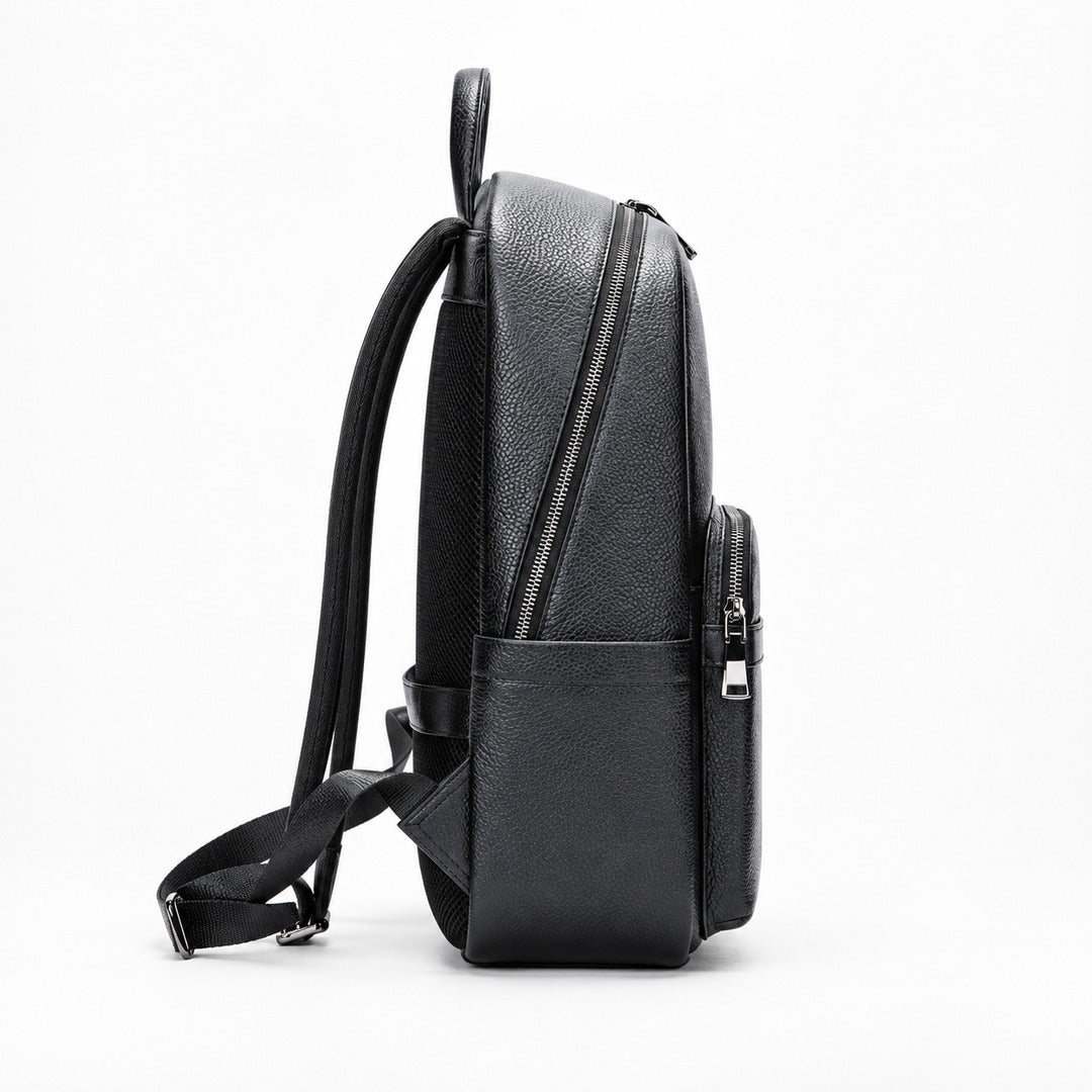 A black pebbled leather backpack shown from a side profile view against a clean white background.
