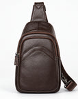 A dark brown leather crossbody bag with a matching adjustable shoulder strap, shown against a plain white background.