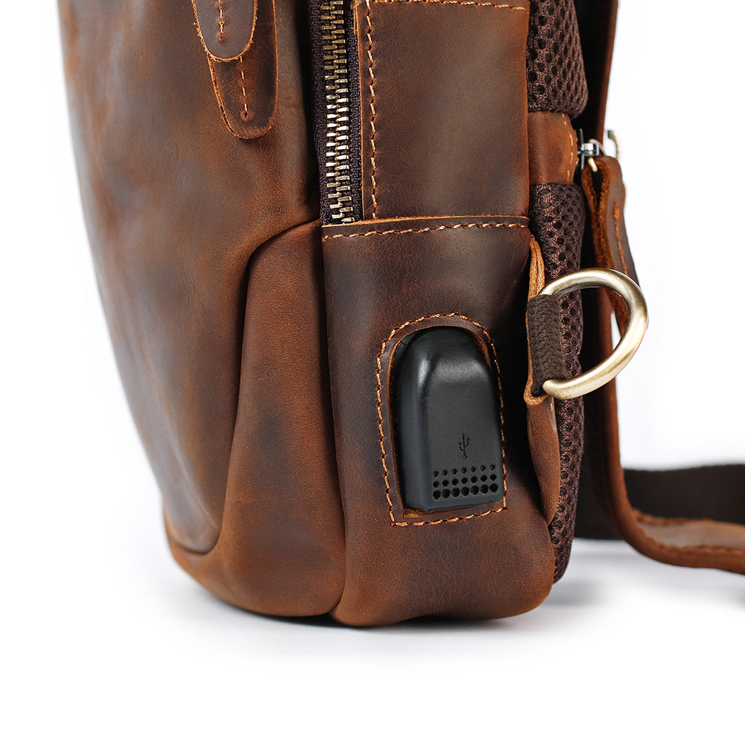 Men’s brown leather sling bag side view with USB port