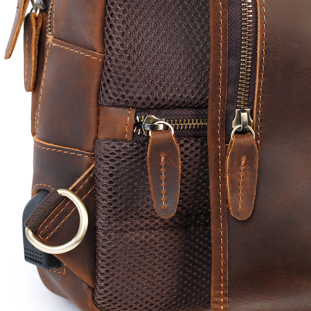 Men’s brown leather sling bag close up zipper detail