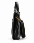 Men's black full-grain leather tote bag side view with a narrow gusset and detachable shoulder strap