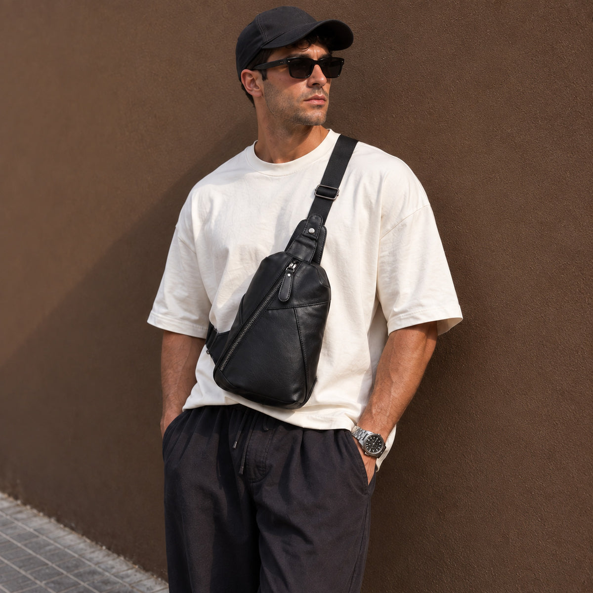 Men's outfit featuring a black full-grain leather sling bag