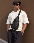 Men's outfit featuring a black full-grain leather sling bag