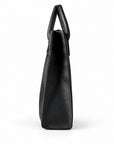 Minimalist black full-grain leather tote side profile with a narrow gusset and rounded handles