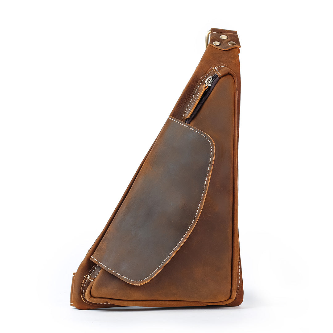 Brown leather sling bag on a white background