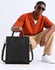 Modern black leather work tote for men with large vertical design, dual carry handles and adjustable shoulder strap