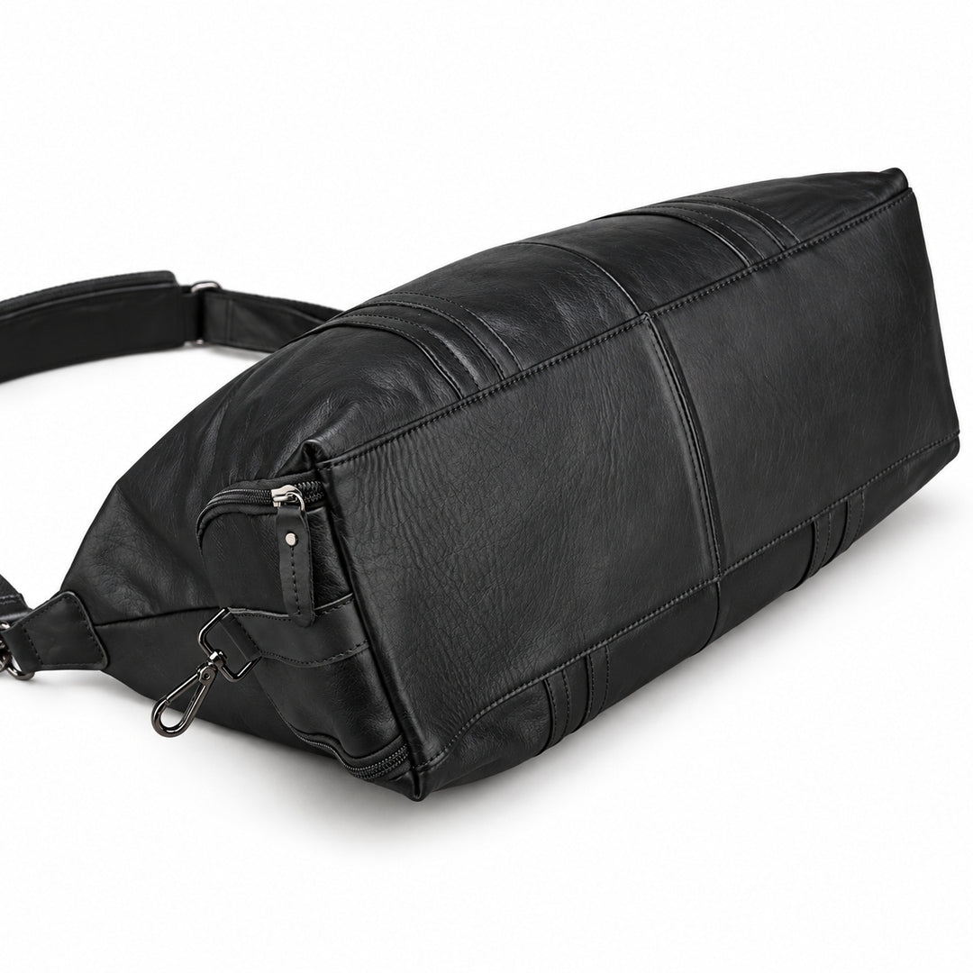 Modern black full-grain leather duffel bag base with a center seam and stitched edges.