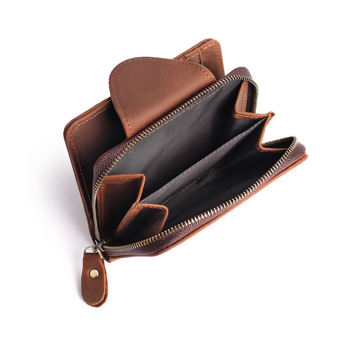 Open view of a brown leather wallet with multiple compartments and a durable zipper, designed for coins and cash