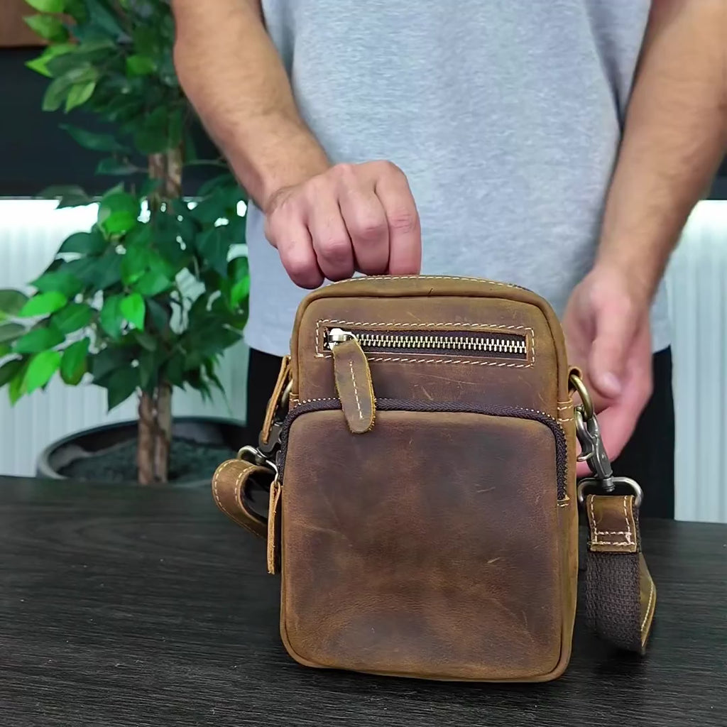 review of riven brown handmade crossbody leather bag for men on table