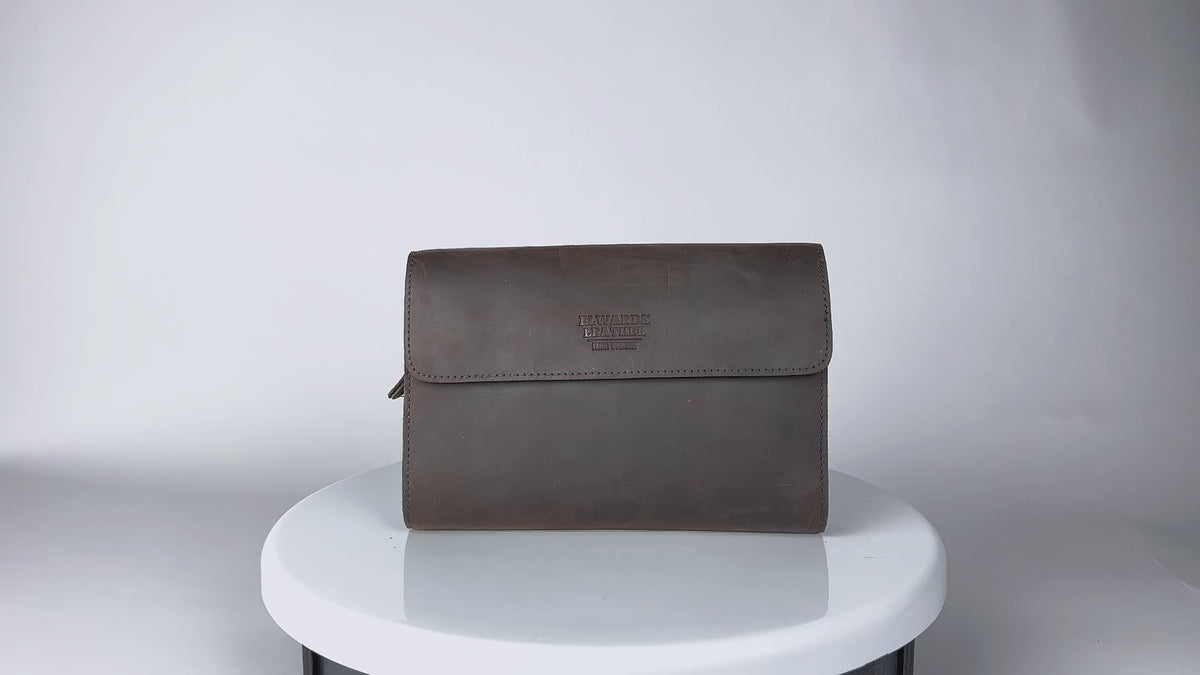 Video highlighting details and quality of brown leather clutch, men's wrist bag, designed for style and durability.