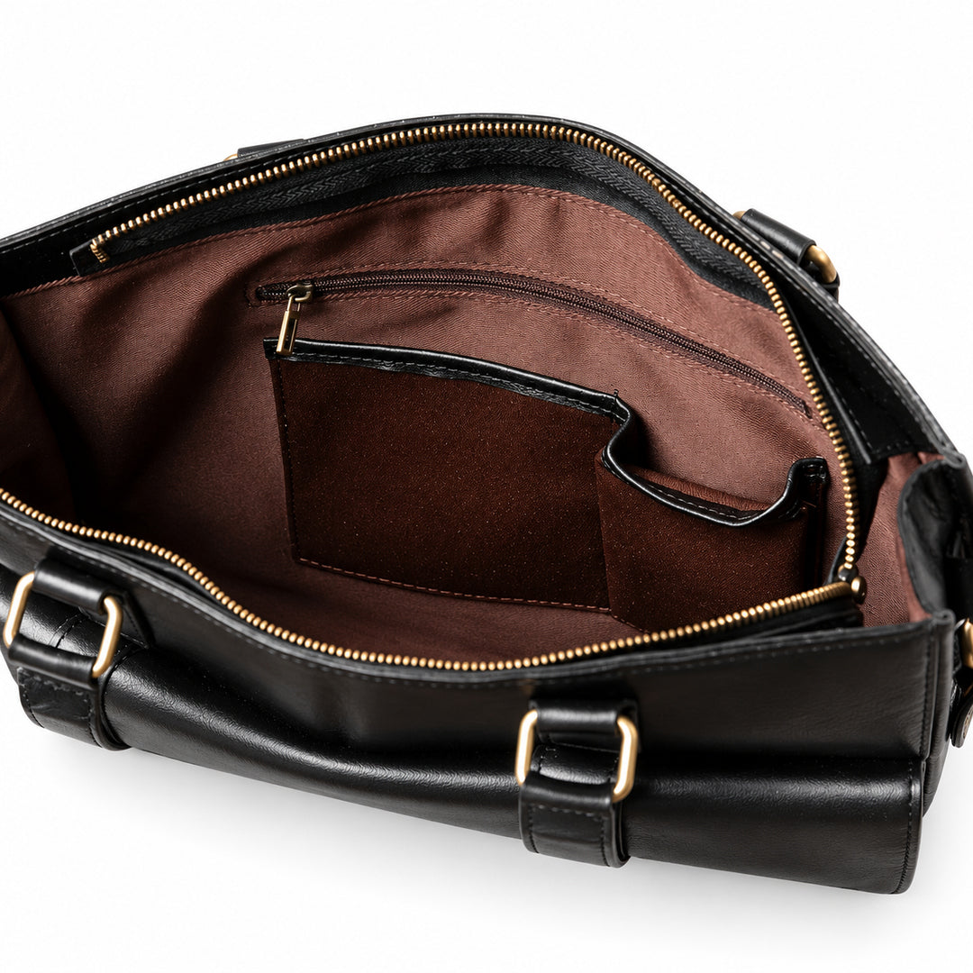 The open black leather briefcase reveals brown lining, a zipped interior pocket and two leather-trimmed organizer pockets.