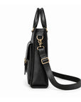 A black leather briefcase is shown in side profile with a slim gusset, brass-tone clasp and adjustable shoulder strap.