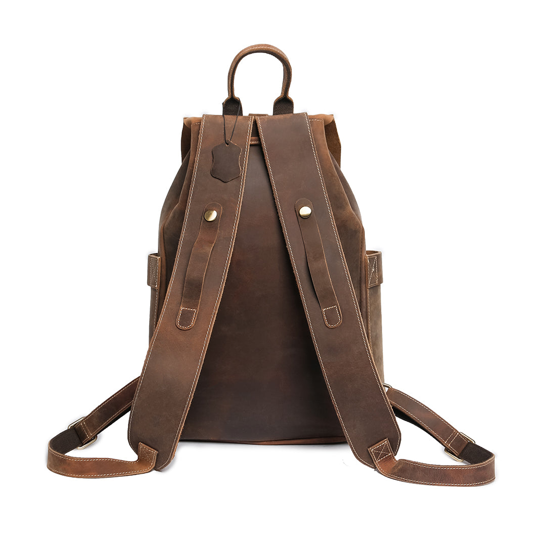 Back view of a vintage brown Crazy Horse leather backpack with reinforced straps, metal hardware, and a minimalistic design.