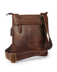 Rear view of a brown leather bag with adjustable strap, highlighting versatility and Crazy Horse leather craftsmanship.