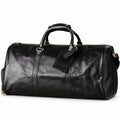 Refined black full-grain leather duffel bag at an angle showing its rounded end and leather trim