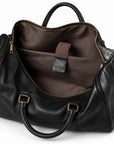 Refined black full-grain leather duffel bag inner sleeve with a fabric retaining strap
