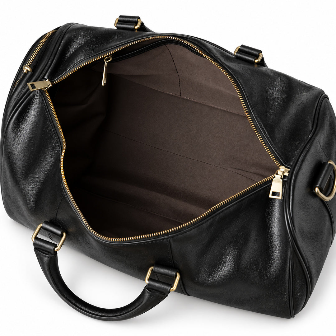 Refined black full-grain leather duffel bag open main compartment with brown fabric lining
