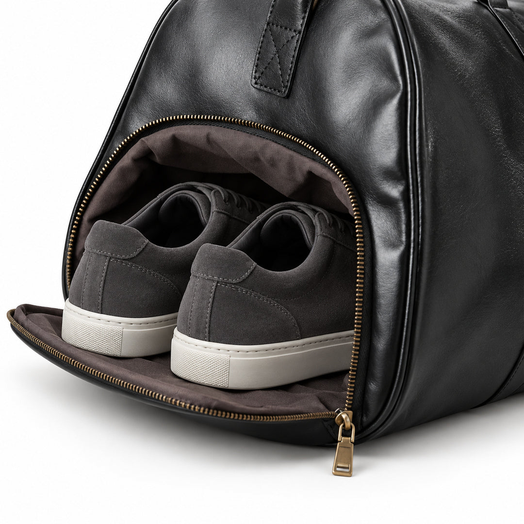 Refined black full-grain leather duffel bag open main compartment with brown fabric lining