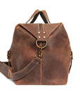 Side profile of vintage travel duffle bag, showcasing its elegant design and reinforced stitching for durability.
