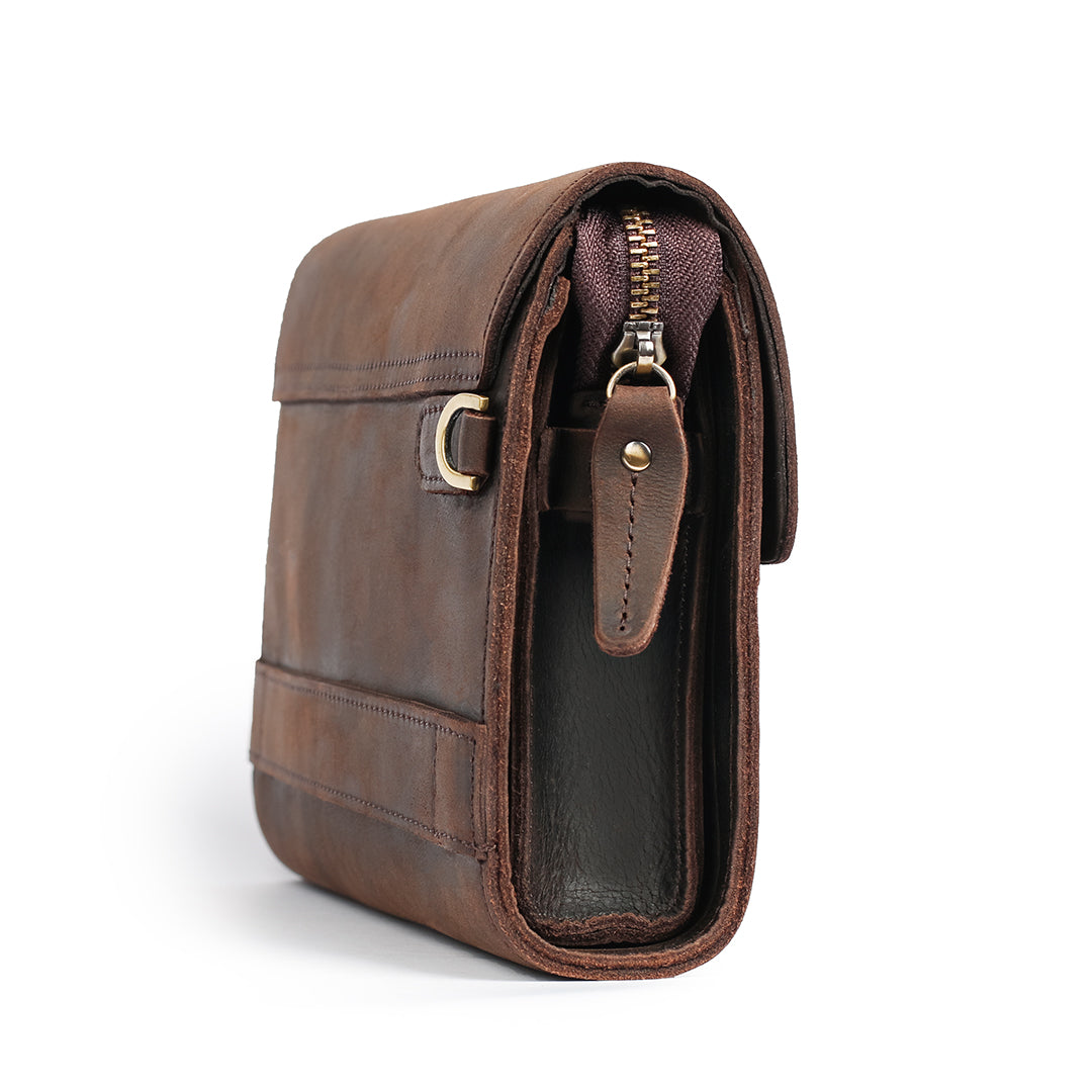 Side view of a dark brown men&#39;s leather clutch, showcasing its spacious interior and detailed craftsmanship.

