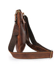 Slim side view of brown leather crossbody bag showcasing compact design and reinforced stitching for everyday use.