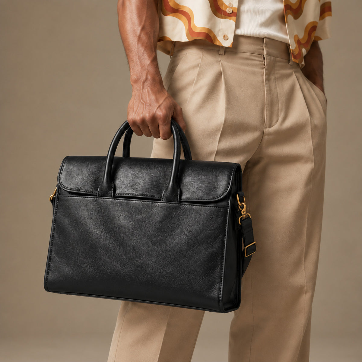 Slim black leather briefcase for men with top handles, flap design and detachable adjustable shoulder strap