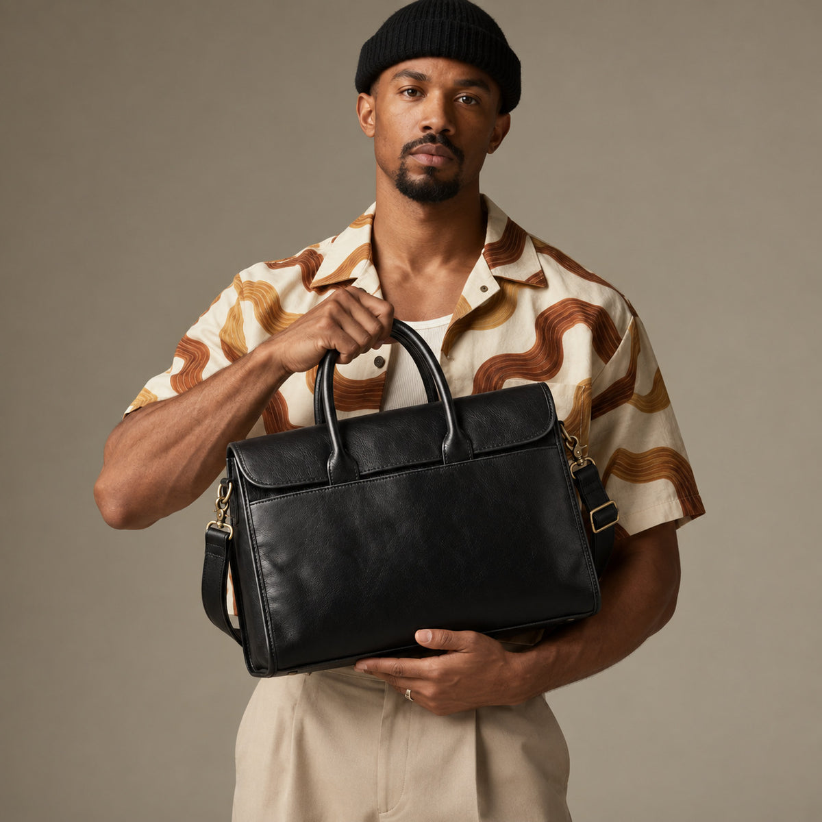 Slim black leather business briefcase for men with top handles, removable shoulder strap and professional work bag design