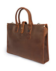 Elegant brown classic leather bag with sturdy handle and vintage design, side view.