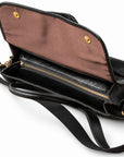 A top view of the black full-grain leather briefcase shows the closed main zipper beneath its brown-lined flap.