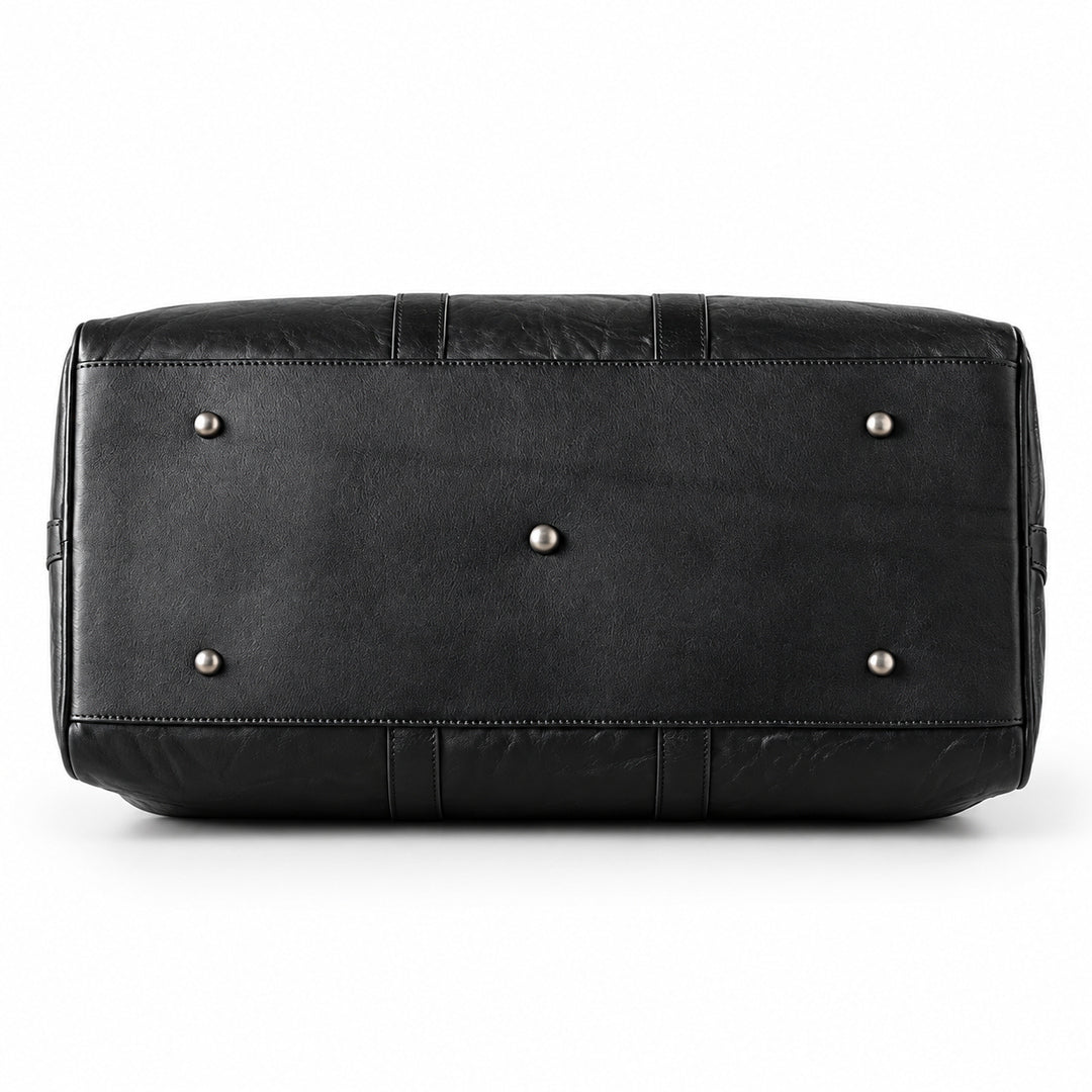 Textured black full-grain leather weekender bag base with five silver-tone protective feet