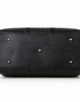 Textured black full-grain leather weekender bag base with five silver-tone protective feet