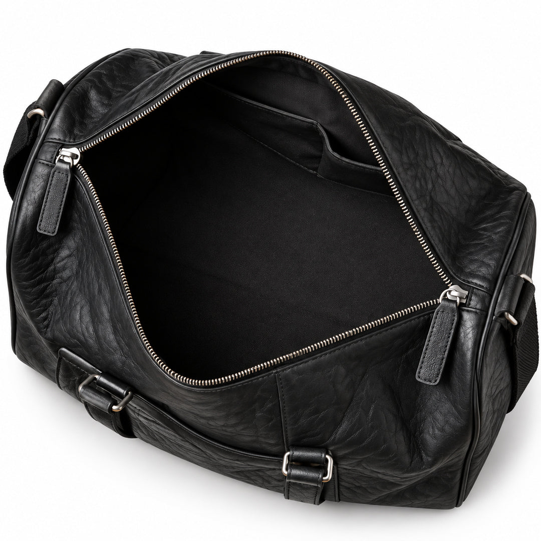 Textured black full-grain leather weekender bag open main compartment with black lining