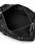 Textured black full-grain leather weekender bag open main compartment with black lining