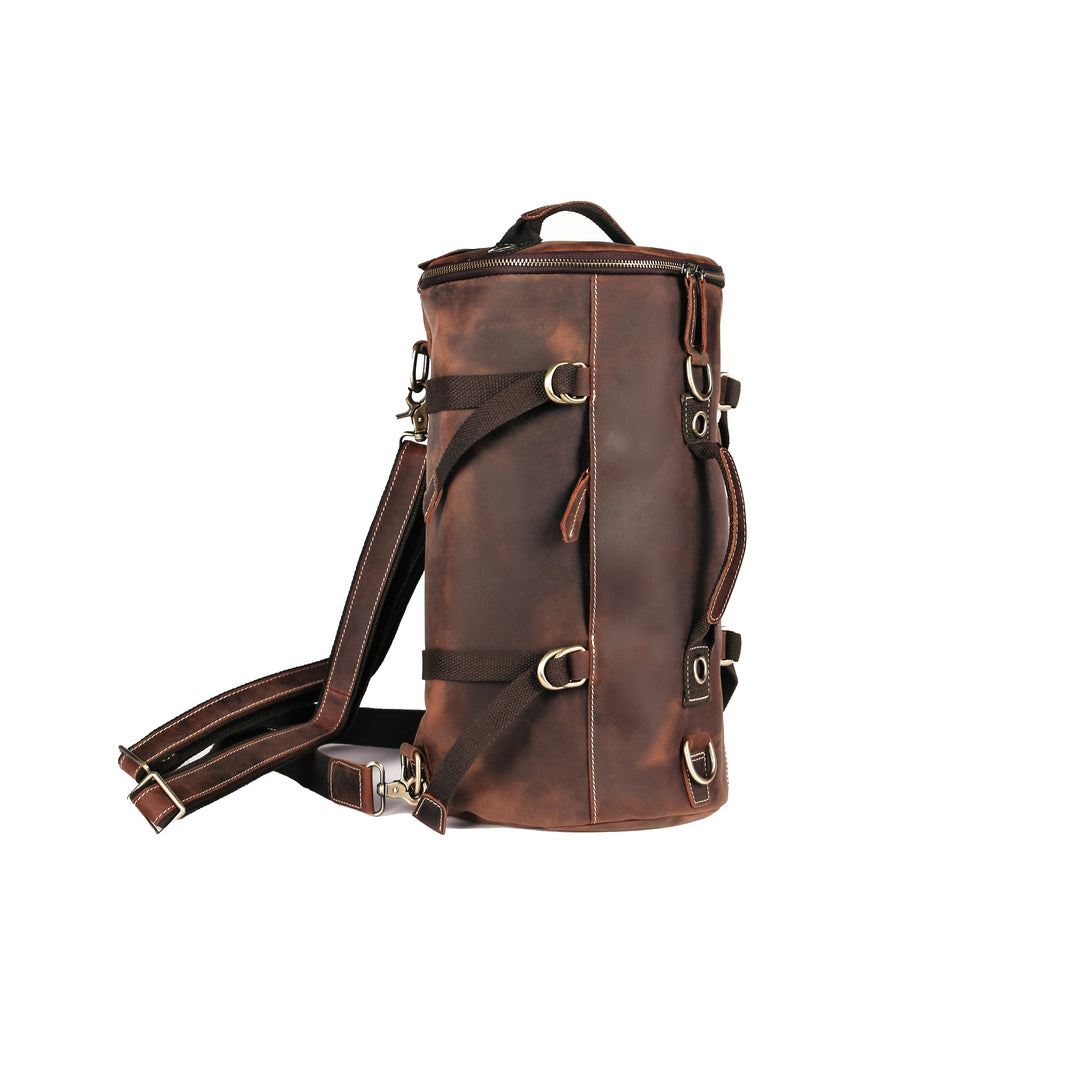 Vintage leather backpack in a side view, handmade from Crazy Horse leather, perfect for travel and everyday use.